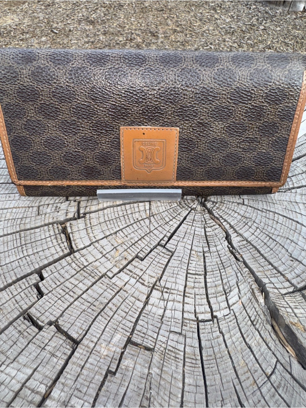 Celine brown leather wallet with kiss lock coin compartment.